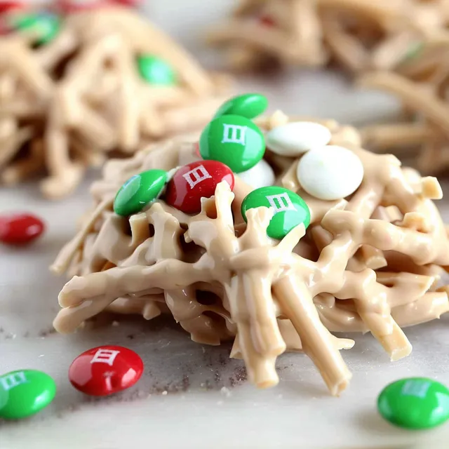 A close up of a holiday haystack with marshmallows and M&M's.