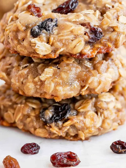 Three stacks of oatmeal raisin cookies.