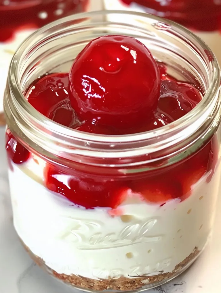A jar of cherry cheesecake with a cherry on top.
