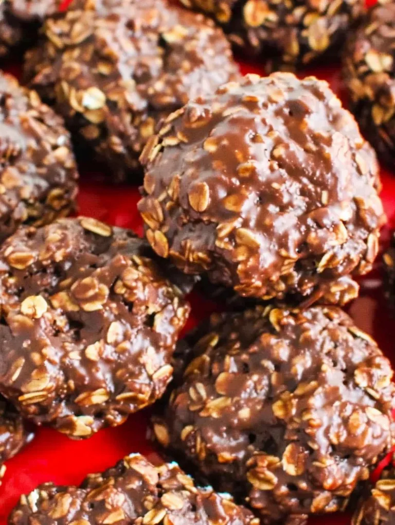 A plate of chocolate covered cookies.