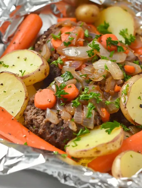 A beef and vegetable hobo dinner.
