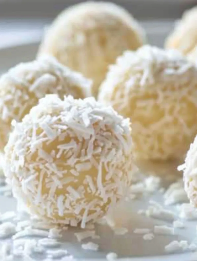 Coconut Eggnog Truffles on a plate.